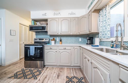 South Haven Cottage | Unwind in Riverfront Comfort — Hot Tub, Fire Pit, Boat Slip, Kayaks