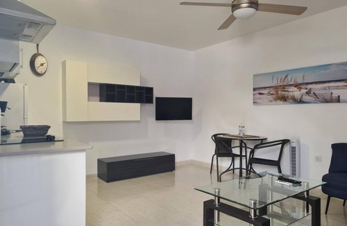 Playa de Arinaga Apartment | Vacation 'Casa Paula - 12' with Mountain View, Shared Pool and Wi-Fi