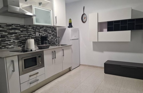 Playa de Arinaga Apartment | Vacation 'Casa Paula - 12' with Mountain View, Shared Pool and Wi-Fi