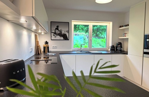 Oberstdorf House | Vacation home Allgäu: eat-in kitchen, fireplace, 4 bedrooms, 3 bathrooms, terrace & hot tub