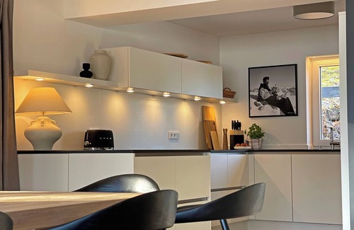 Oberstdorf House | Vacation home Allgäu: eat-in kitchen, fireplace, 4 bedrooms, 3 bathrooms, terrace & hot tub