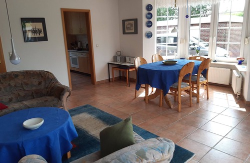 Dornumersiel House | Vacation home directly on the river, close to the beach, WLAN, TV, 6 beds, own jetty