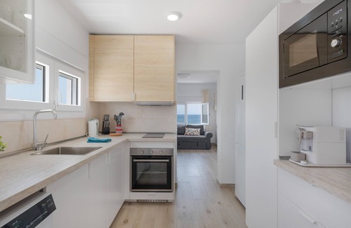 Playa Quemada Apartment | Vacation 'La Casa De La Playa' with Sea View, Wi-Fi and Air Conditioning