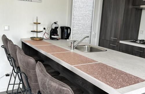 Scherpenisse Ski Chalet | Vakantiepark de Zeeuwse Parel - Noordzee Deluxe