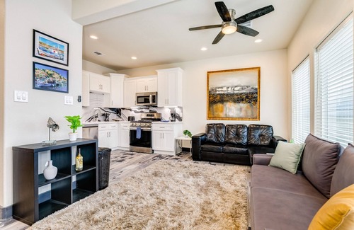 Bacliff House | Vibrant orange retreat with an enclosed yard, grill, and ocean views - dogs ok