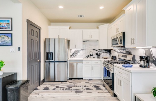 Bacliff House | Vibrant orange retreat with an enclosed yard, grill, and ocean views - dogs ok