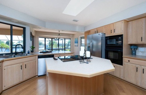 Punta Gorda House | Villa Tropical | Waterfront Luxury in Punta Gorda Heated Pool Spa Dock