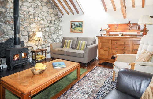 Gaerwen Cottage | VINE TREE BARN, pet friendly, with open fire in Pentre Berw
