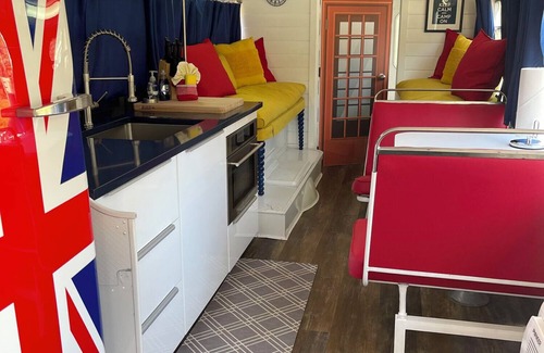 Mill Spring Apartment | Vintage 1962 double decker bus on the creek, gas grill, fire pit, short walk to pool and playground, sleeps 4-5.