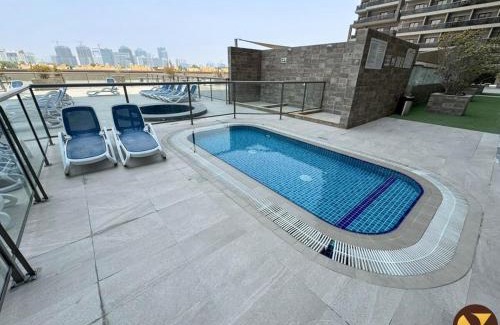 Dubai Sports City Apartment | Vogue Elite Sports City One Bedroom Apartment with Balcony with Golf Views