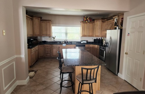 Rehoboth Beach House | Waterfront home with dock, gazebo, and fenced yard