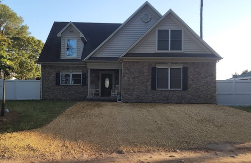 Rehoboth Beach House | Waterfront home with dock, gazebo, and fenced yard