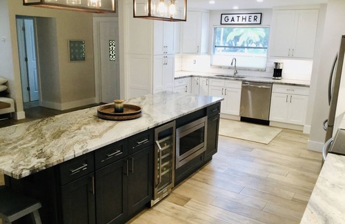 Yacht Club Villa | Waterfront luxury 4 bed 4 bath with large heated pool & dock