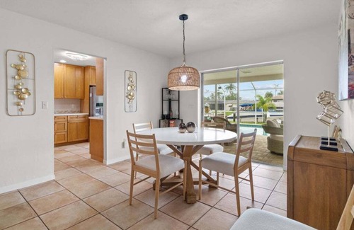 Caloosahatchee House | Waterfront Serenity beckons you to experience the ultimate canal-side retreat in stunning Cape Coral