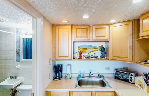 Atlantic Beach Condo | Waterfront suite with pool, beach access, Wifi & balcony