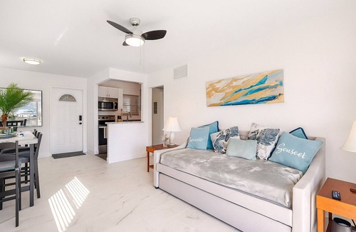 Capri Isle Condo | Waterfront Treasure Island Oasis, Dock, Sunsets & Walk to Beach + John’s Pass