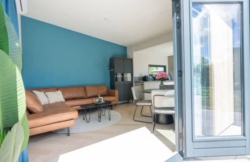 Scharendijke House | Welcome to Muralt 111, a modern chalet with everything for a carefree stay. Enjoy the cozy living ro