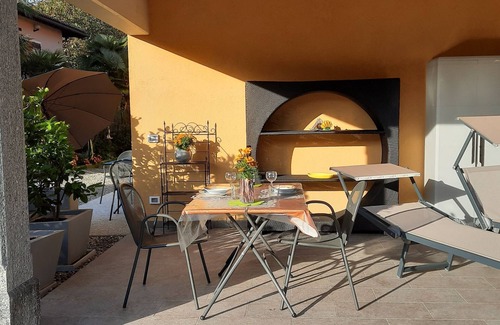 Cannobio Apartment | Well-kept FEWO covered terrace 100 mtr to the beach free parking lot