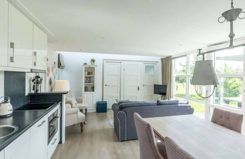 Westenschouwen House | You are guaranteed to unwind and relax in one of the chairs or on the comfy sofa in the central livi