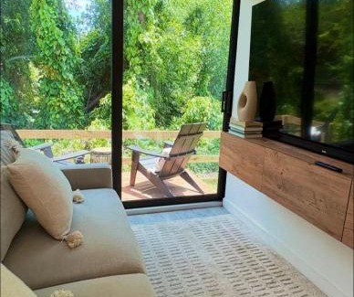 Estero House | Zen Container Tiny Home with Fenced-in Yard, Fire Pit, Centrally located and Pet Friendly