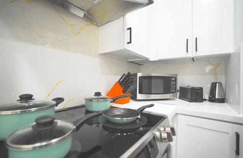 Edenvale Condo | Zen Minimalist 2BR Condo: Prime Location + AC