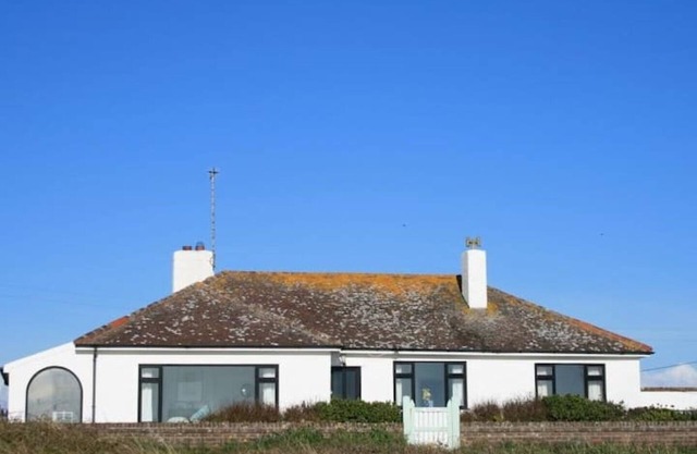 1930's bungalow nr Rhosneigr, opposite beach, large garden and amazing views.