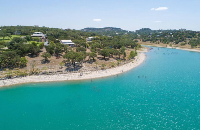 400 feet of private lake front, home and cottage on 3.4 acres, sleeps 16!