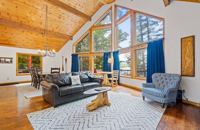 8.5-acre lakefront retreat with private beach, deck, grill, firepit, & game room