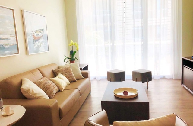 A modern style, freshly, large beachfront apartment in the middle of the action