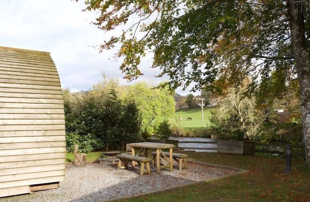 A premium wigwam with hot tub that sleeps 4 guests, 2 adults are included.