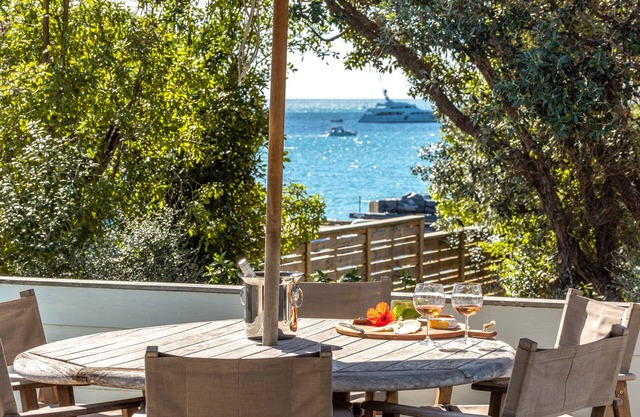 All day sun house with metres away from the golden sands of Onetangi Beach.