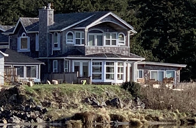 Amazing estuary and ocean views! Relax on the deck with the fire-pit & jacuzzi