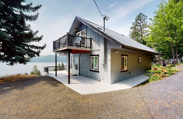 Amazing lake-view cabin with balcony, firepit, grill, wood stove, & W/D