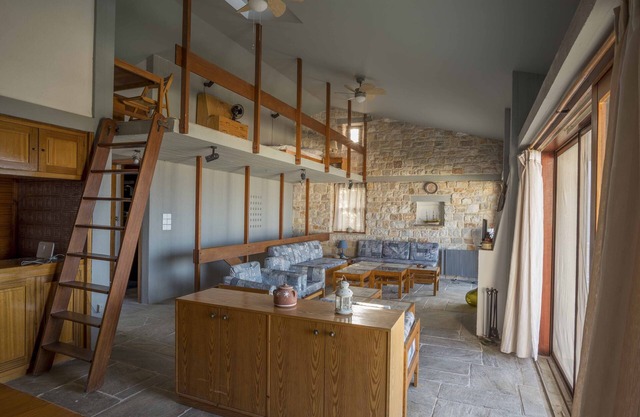 An architect's masonry house,Anavyssos, Attica, with view to Aghios Nikolaos be