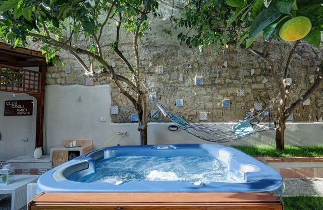 Apartment immersed in a lemon grove oasis with an enveloping whirlpool