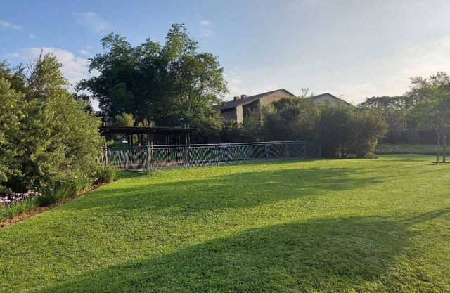 Apartment with Lush green garden and a Pool