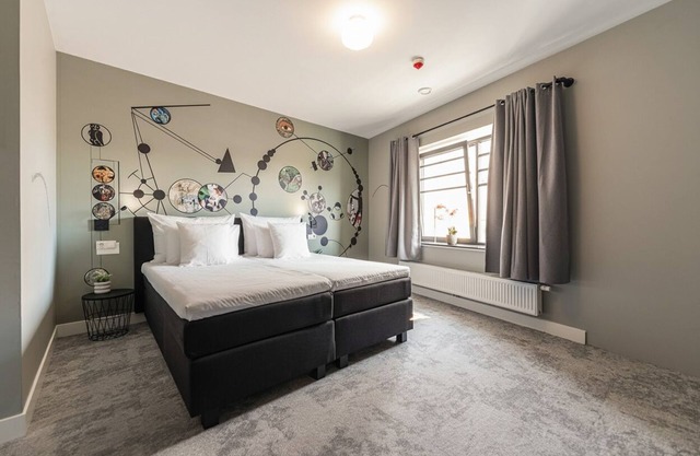 Artist-inspired suite for 2 with king bed, private kitchen, air conditioning, and modern comforts. Perfect for couples, solo travelers, or business stays.
