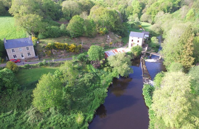 Authentic mill with feet in water (near the sea)