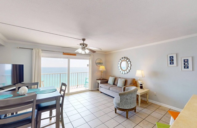 Beachfront condo with a kitchen, located in a gated resort featuring pools, hot tub, and a tiki bar!