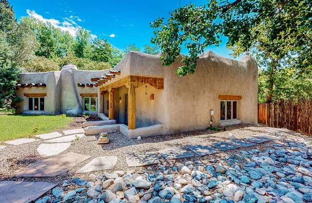 Beautiful adobe home steps the plaza with private patio and garden