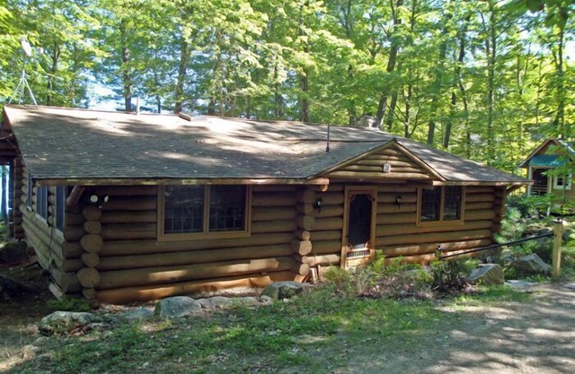 Beautiful open-concept log home in quiet setting on Thompson Lake.