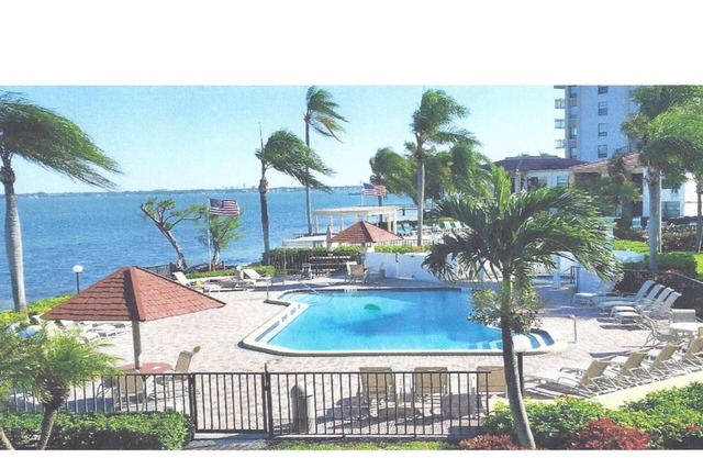 Beautiful water view apartment blocks from the beach. Excellent pool area.