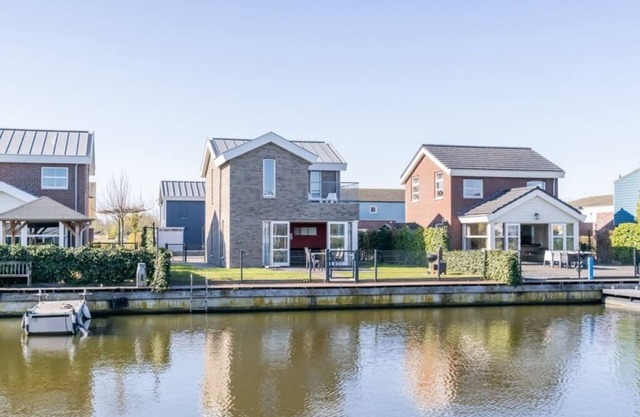 Bright and colorful detached island house with enclosed garden.