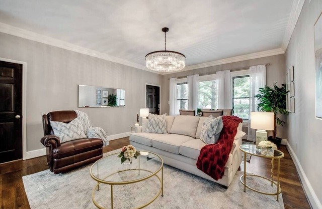 Bright and luxurious 1-bedroom condo combining historic charm with modern comfort. Features a spacious living area with elegant furnishings, crystal lighting, and abundant natural light for a refined Dallas stay.