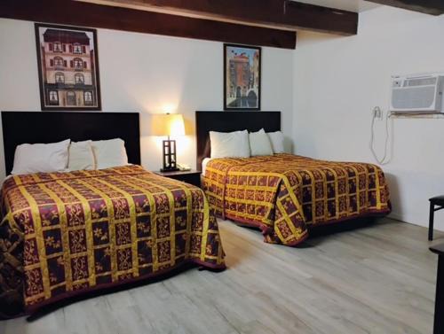 Budget Inn & Suites -Super-Ice Cold Spotless Rooms- Door-to-Door Lit Parking & Lowest Price plus HBO Max,Spanish TV, Internet free!