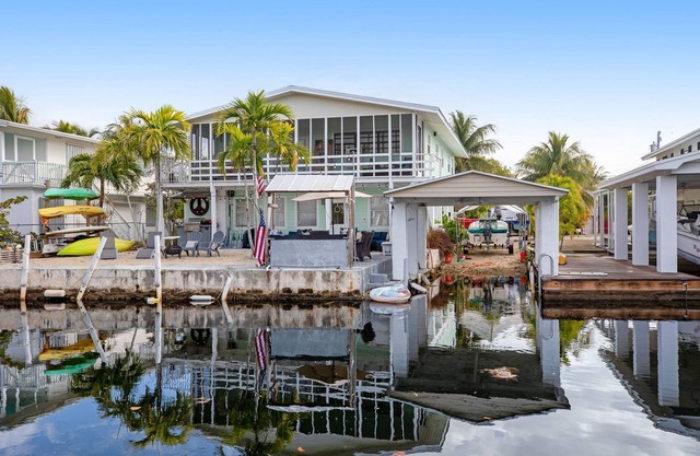 Canal-front Keys escape with amazing view, boat access, firepit, gril, AC, & W/D