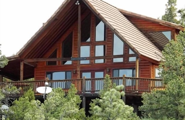 Chalet in the pines with view of ponderosa studded mountains on 2.5 acres.