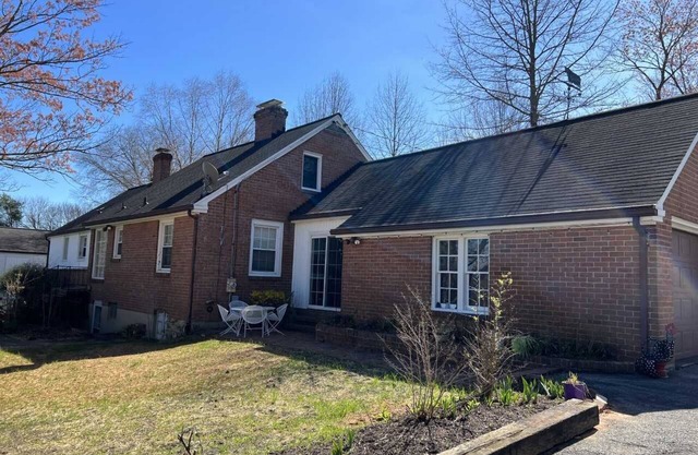Charming brick ranch with an acre of beautiful garden