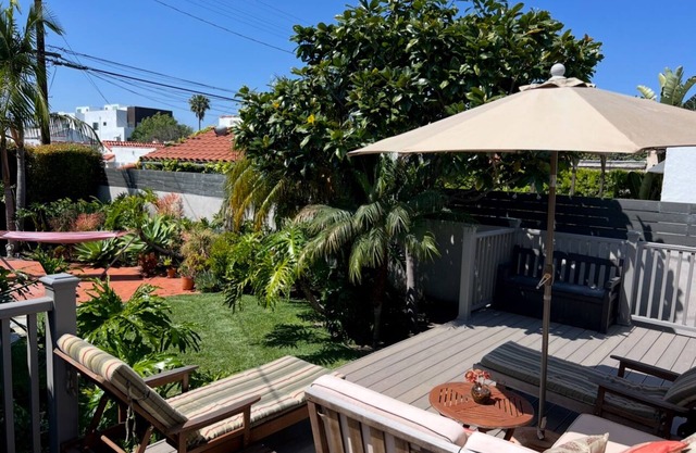 Charming Spanish Bungalow w/lush enclosed yard and back deck