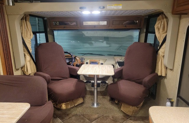 Class A motorhome. In our backyard or a local RV resort.
